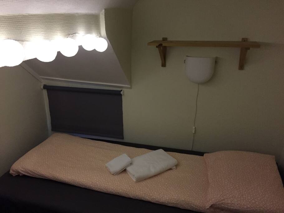 View of sleeping section where you find single bed one and two that can be arranged as a double bed.