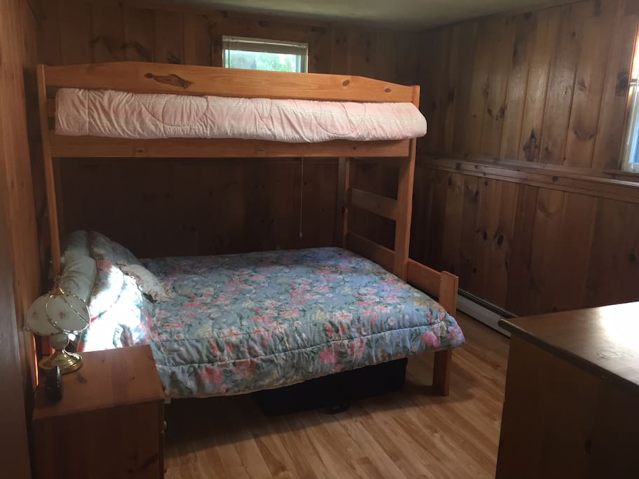 Bedroom #2 - Sturdy wooden bunkbed with queen mattress on bottom and twin on top. Includes closet and dresser.