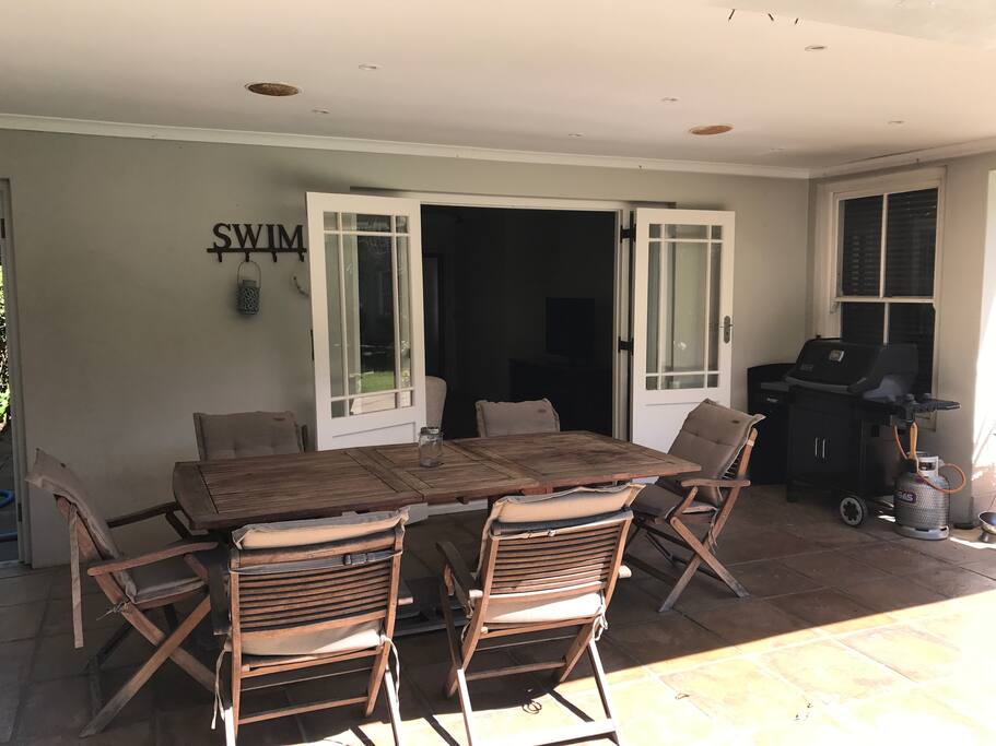 Outdoor covered and sheltered pation with gas barbeque