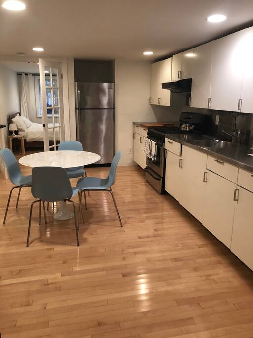 Kitchen with bedroom in background