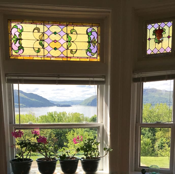 Riversong morning view from the 2nd floor bedroom with original, Victorian era stained glass.