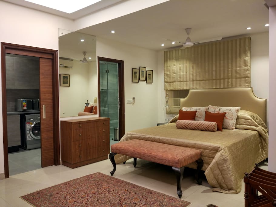 The Bed + entry to the kitchen + the attach bathroom