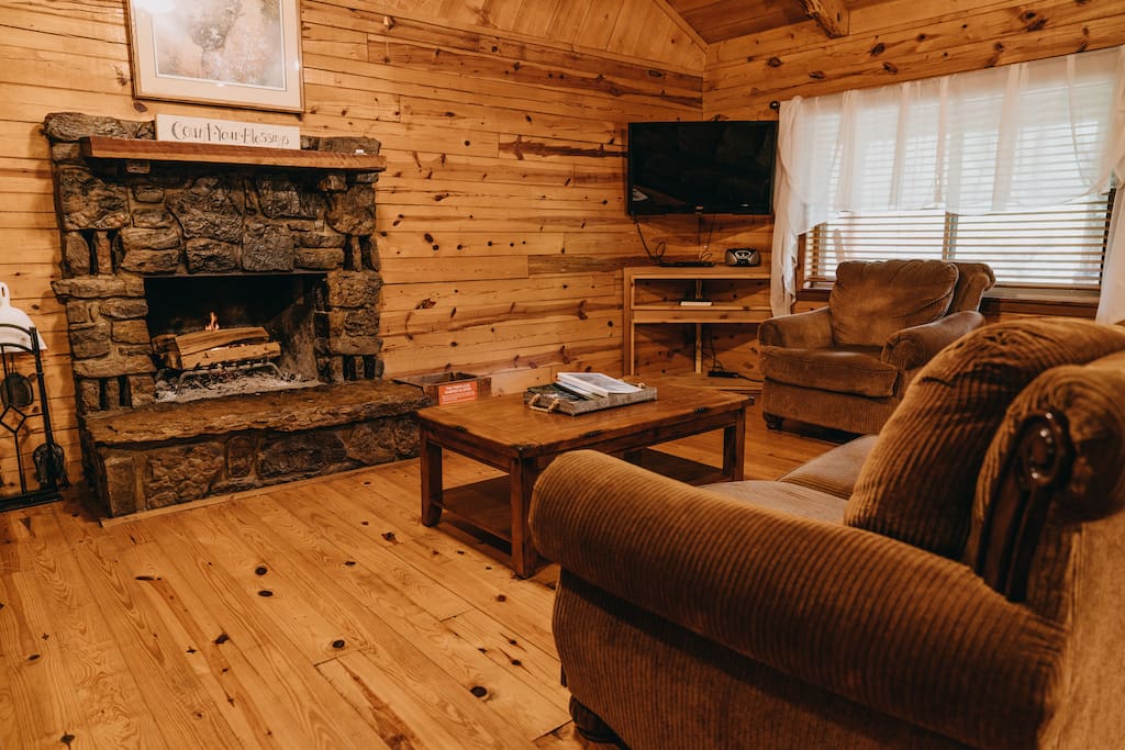 The cabin's cozy living area with fireplace.