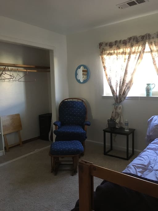 Rocking chair, ottoman, end table and folding TV tray available (in closet) for laptop
