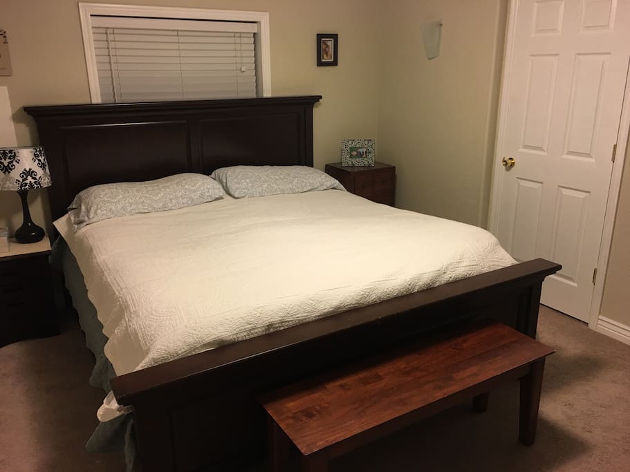 Comfortable king-sized bed with down comforter