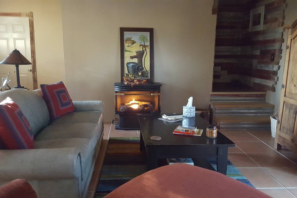 Living room to stairs that lead to upstairs bedrooms.