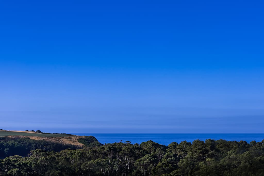 Enjoy the huge back deck with sensational views out to the sea and hills