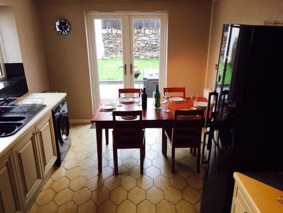 Light and airy kitchen with patio doors out to garden