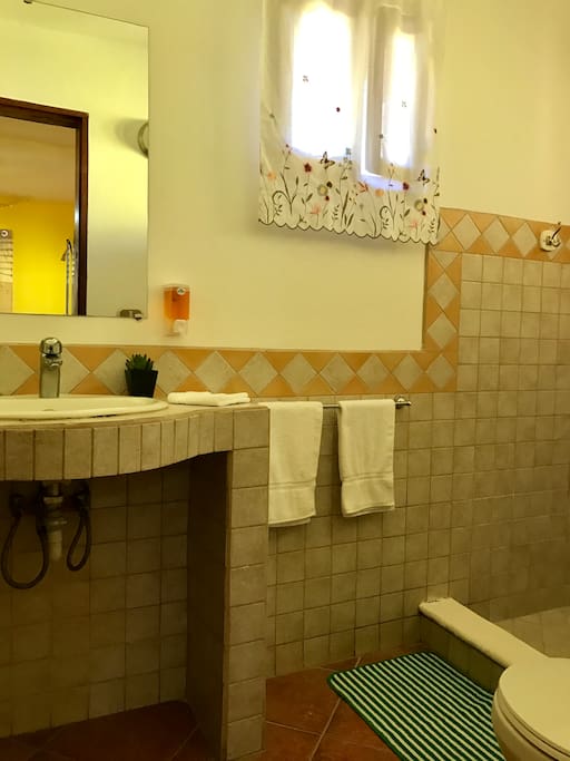 VILLA 2 - Full bathroom with sink and mirror..