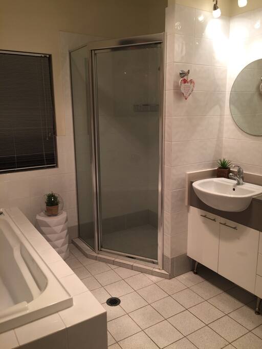 Bath, separate shower and double vanity. Two separate toilets located upstairs and downstairs. Clean.
