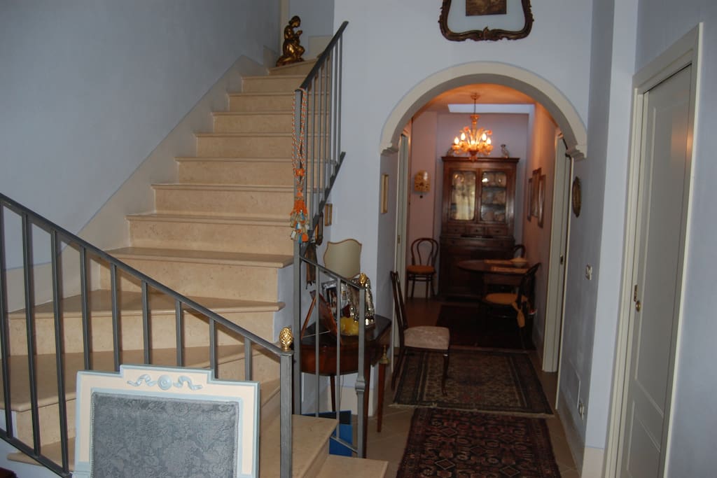Stairs to the first floor and kitchen