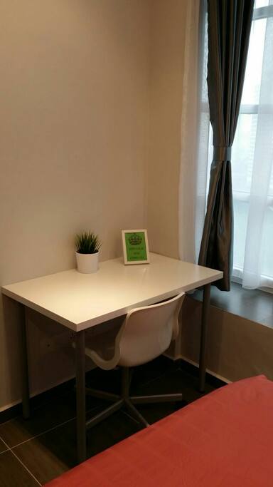 A study/working table in both bedroom
