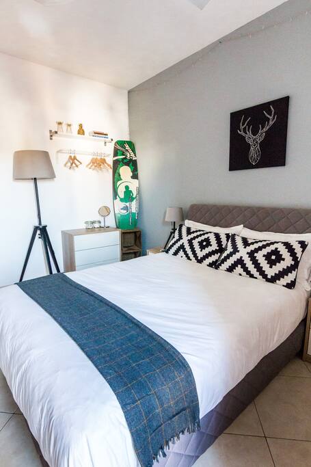 Master bedroom with private bathroom and small balcony