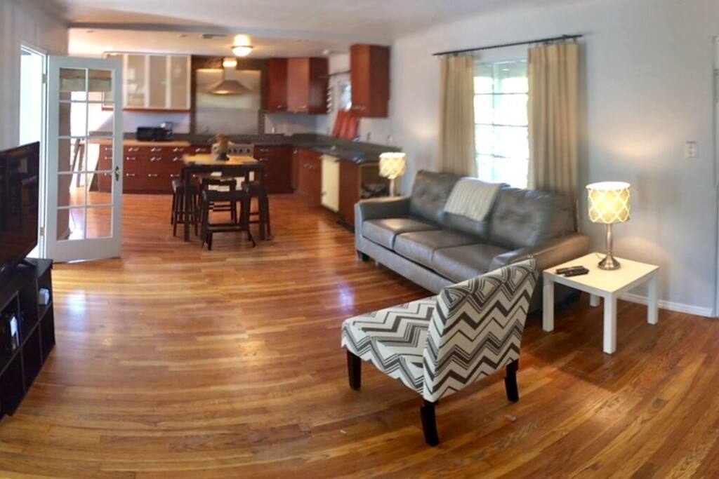 Living room. Open concept. Tv with cable and Internet available. Views of gammage auditorium from front window. Large French doors lots of natural light To large backyard with mature pecan trees.