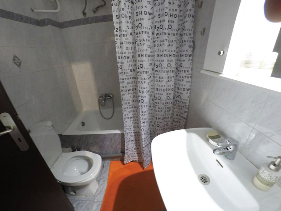 Joined bathroom/toilette with hot tub.