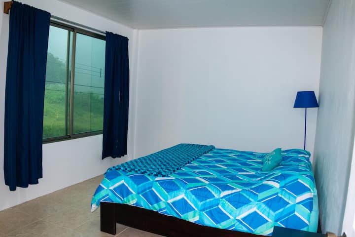 First bedroom of three in the penthouse condo. Features a king sized bed.