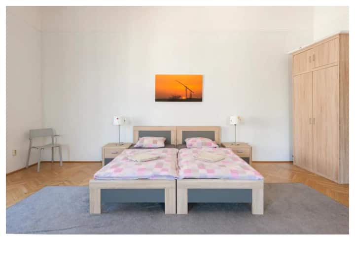 Bedroom 4 is large, bright and it has a tiny private balcony with a good view on nearby streets. It has got a double bed and a single bed as well as a sofa. 

Clean sheets and towels are standard, of course.