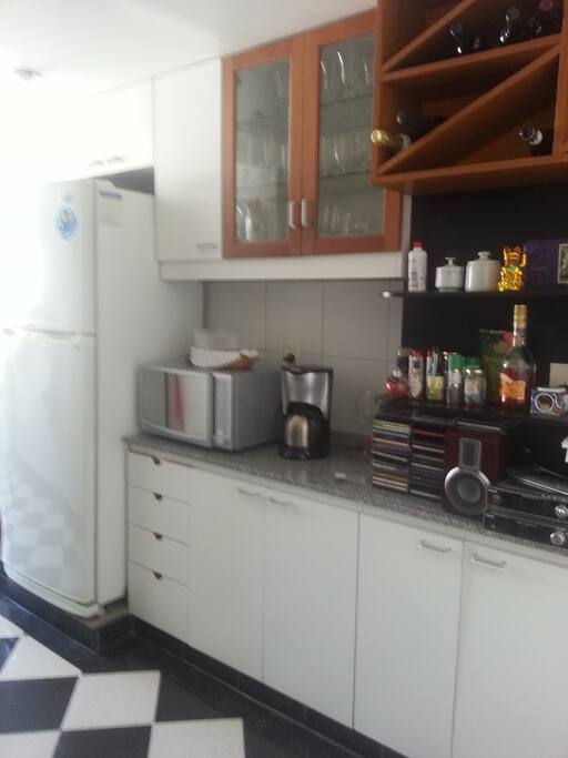Bright, sunny and spacious. Has everything you need to prepare your meals. One exclusive shelf in the refrigerator and another in the freezer. It is a kitchen diner where you can have all your meals.