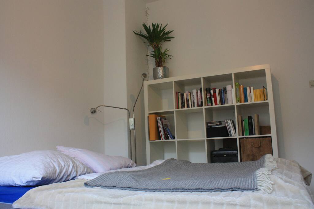 The bed with the bookshelf