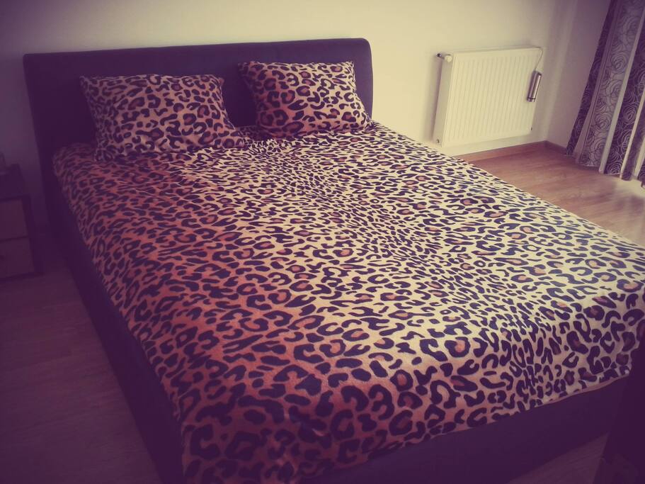 Bedroom queen size bed.