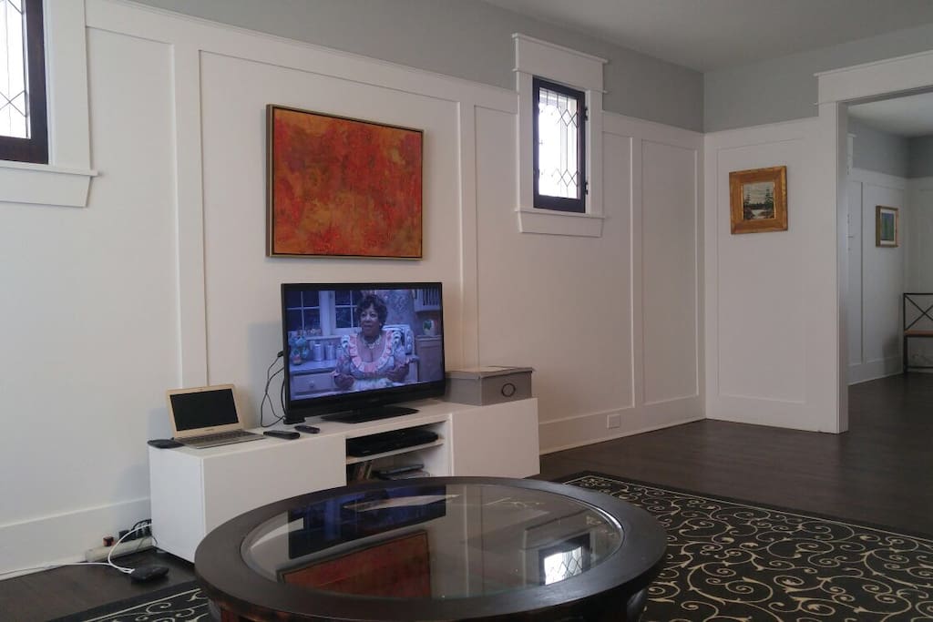 Entertainment center in the living room includes a TV set up with Netflix and a movie collection for cozy evenings in. A large selection of great board games is also available for use