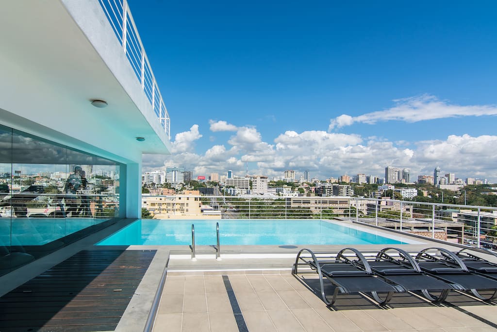 Shared rooftop terrace with pool, Ocean view, City view, lounge chairs and sundeck