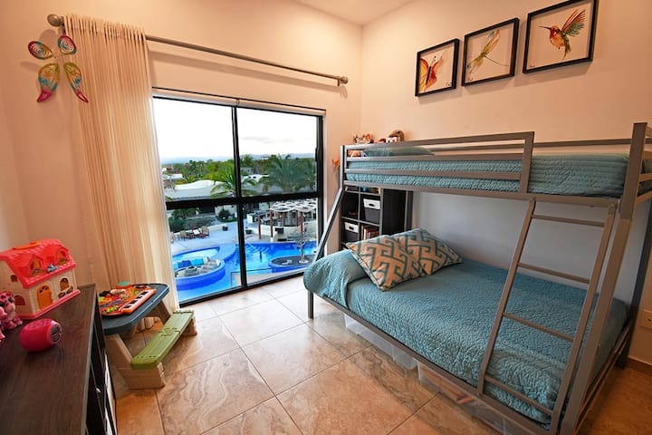 Second bedroom with views of swimming pool (kids toys not there anymore)