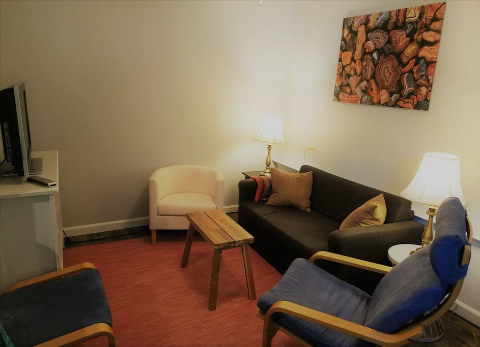 Relax in a comfy-cozy living room with seating for 4, pullout "European Small Double" pullout sofa, plenty of lighting, ceiling fan, HDTV, cable TV, built-in Netflix, HBO, DVR.