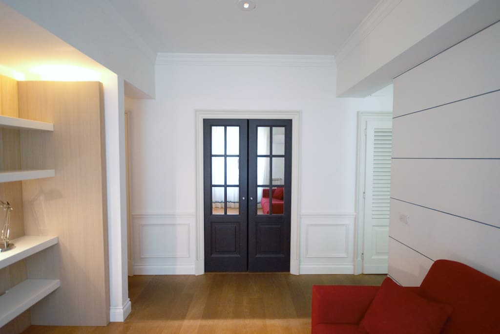 Beautiful living area with double sofa bed, window, TV, Air Conditioning. All the apartment has an elegant wooden floor.