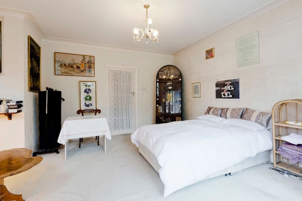 Double bed, study table, now with a long mirror added on wall and new bed tables