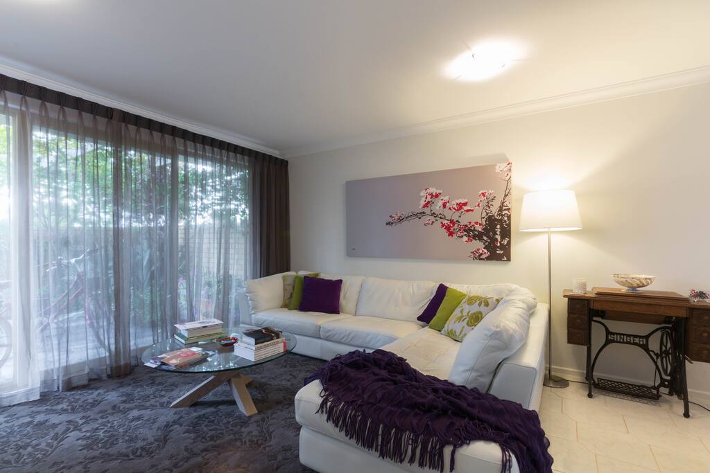 Living area with smart TV and Netflix looking out to front courtyard