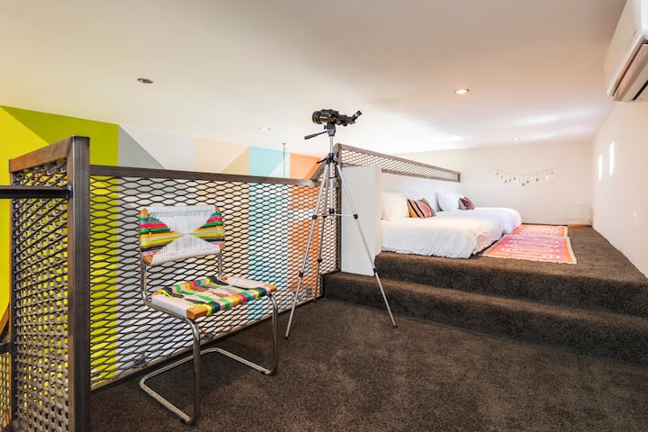 Upstairs loft. Two twin-XL beds with futon covers. The space can be used as a lounge and meditation area or you can make up the beds with linens we provide for additional sleeping beds.