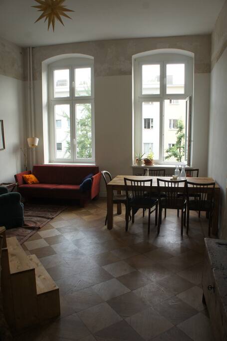 living room with dining table & sofa bed