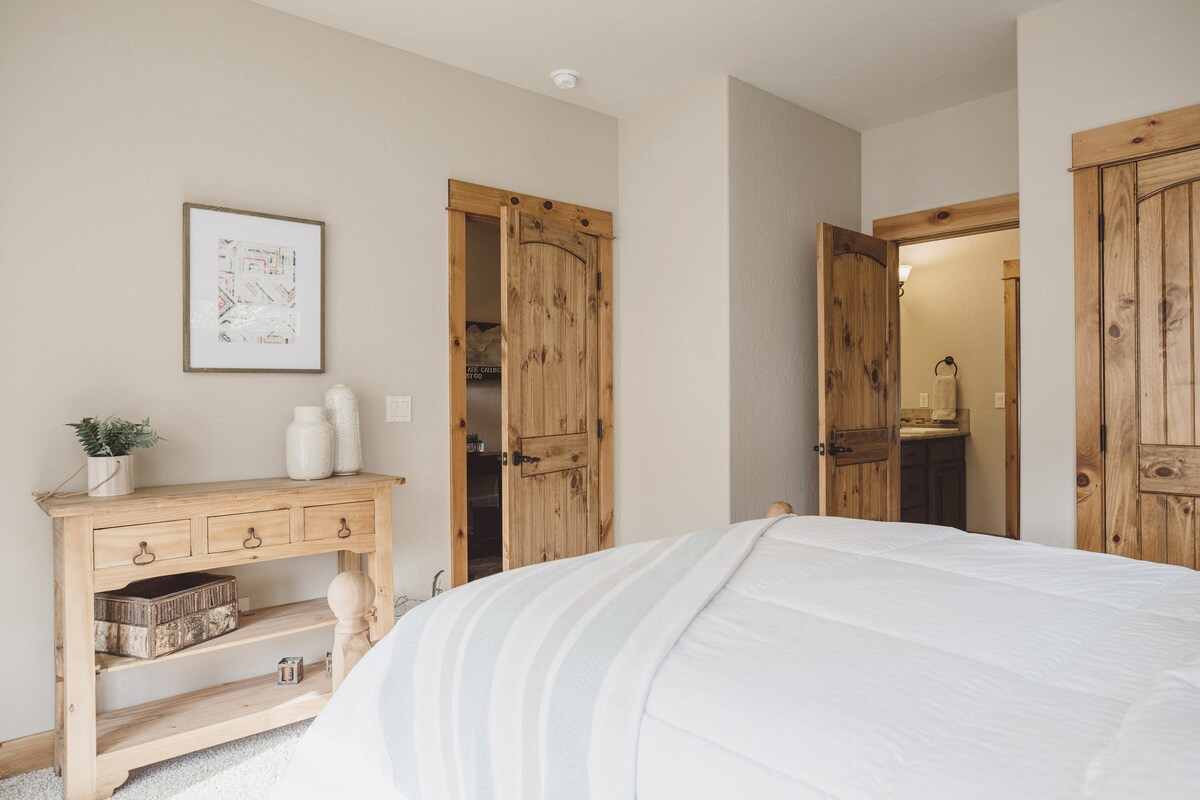 Main floor guest bedroom (king bed), with attached jack-n-jill bath, and views to the west.