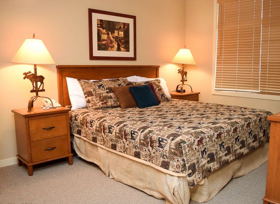 The master bedroom features a king sized bed with an attached 4 piece ensuite