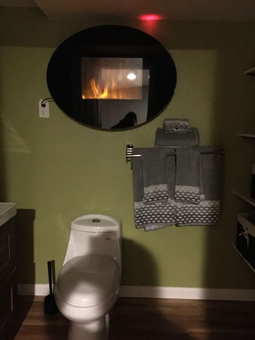 Wall electric fireplace in the bathroom