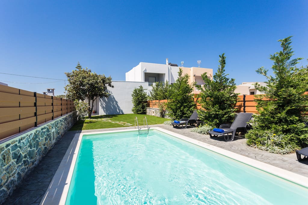 Private swimming pool with sun beds