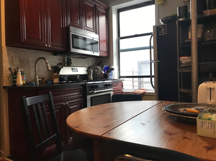 Clean shared kitchen. You are welcome to cook to your hearts delight. Pots/pans/dishes are all communal. Feel free to keep any food/groceries in the fridge.