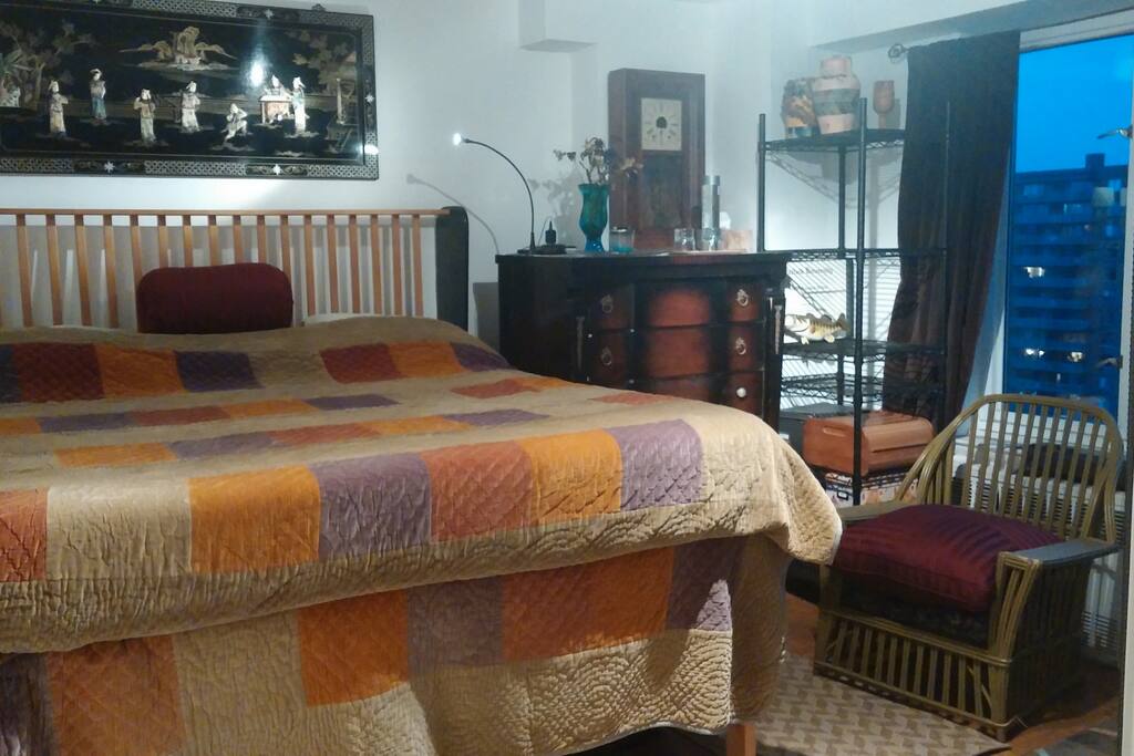 King bed with memory foam mattress in private room.