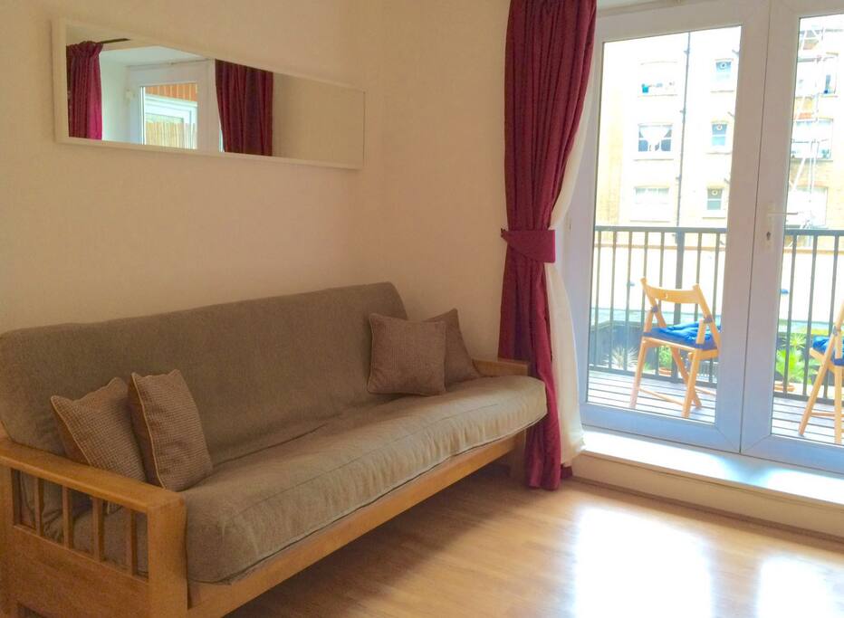 Lounge area with two double sofa beds.