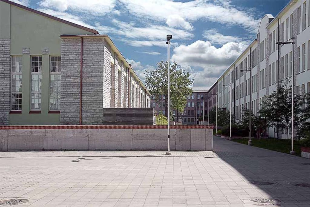 Aparment is locating back of the courtyard (brown house)