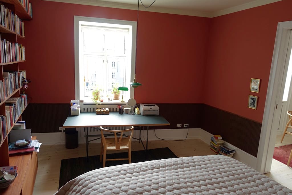 Bedroom nr. 1 with king size bed and quite work space.