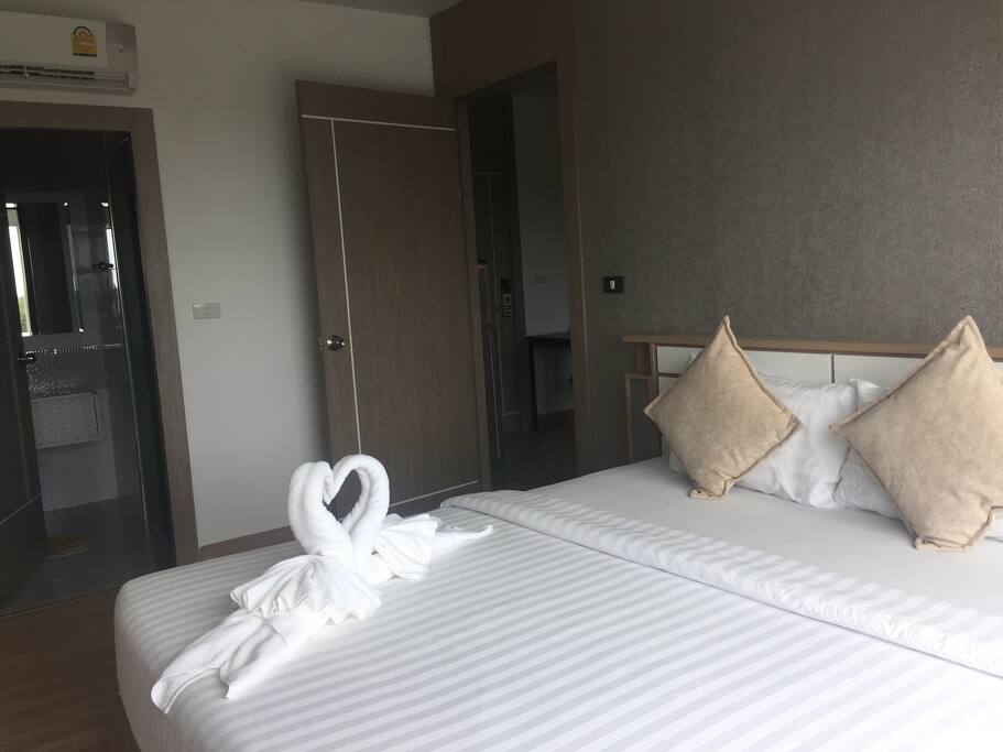 king size bedroom with a private bathrooom
