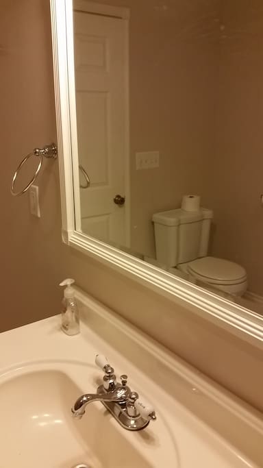 Spacious full bathroom with a clawfoot tub/shower.