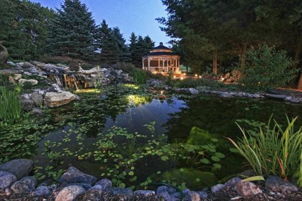 Nature Pond - Screened Gazebo with Large Table & 10 Swivel Rocker Chairs