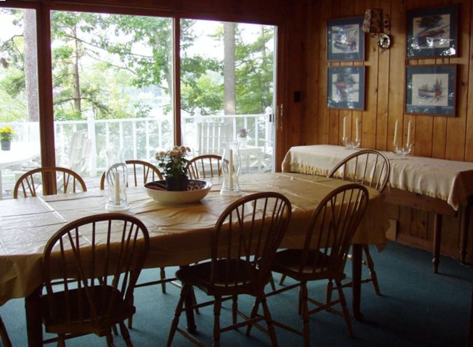 The dinning room seats 10 and overlooks deck and harbor
