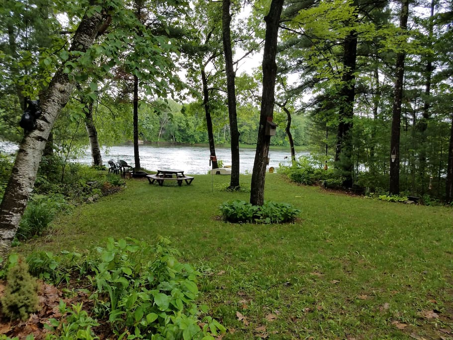 View from back deck. There is a second fire pit back by the river