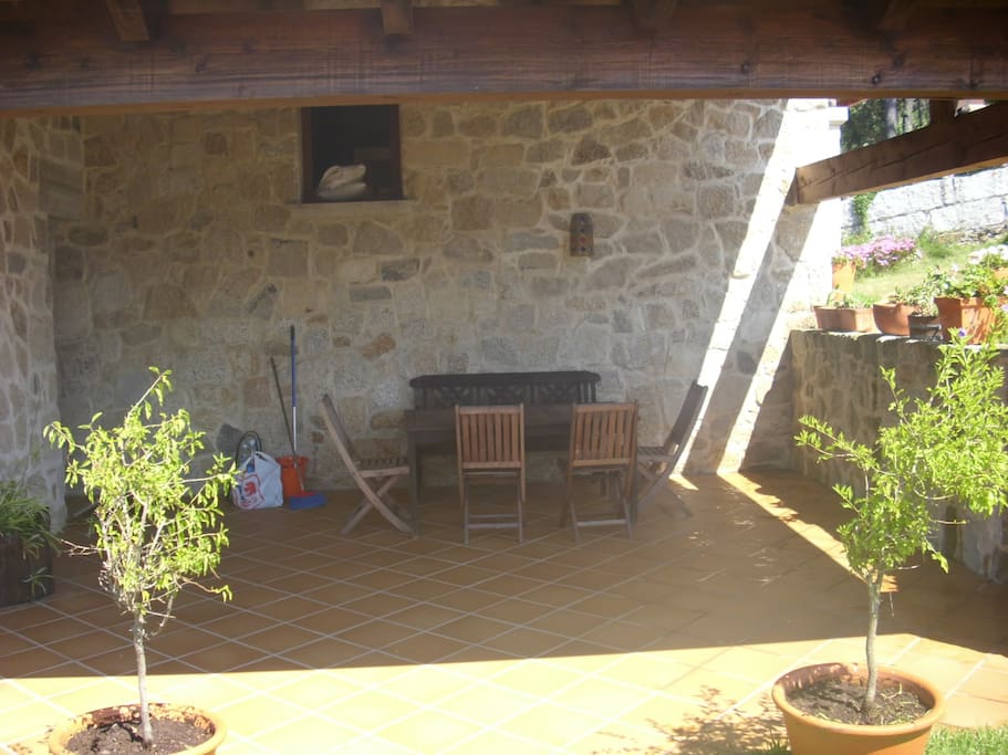 Terraza con porche oeste