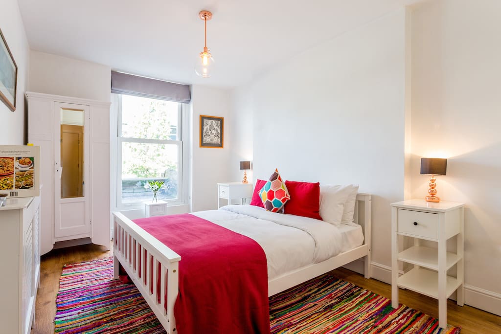 Master bedroom with double bed and soft furnishings that make it a tranquil space to get a great nights sleep