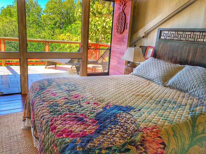 Queen-sized bed in the loft bedroom. Ocean view during the day, starry skies at night.